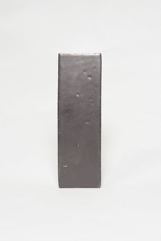 Artisan Baked smoky dark brown thin brick tile with a matte glaze and textured surface