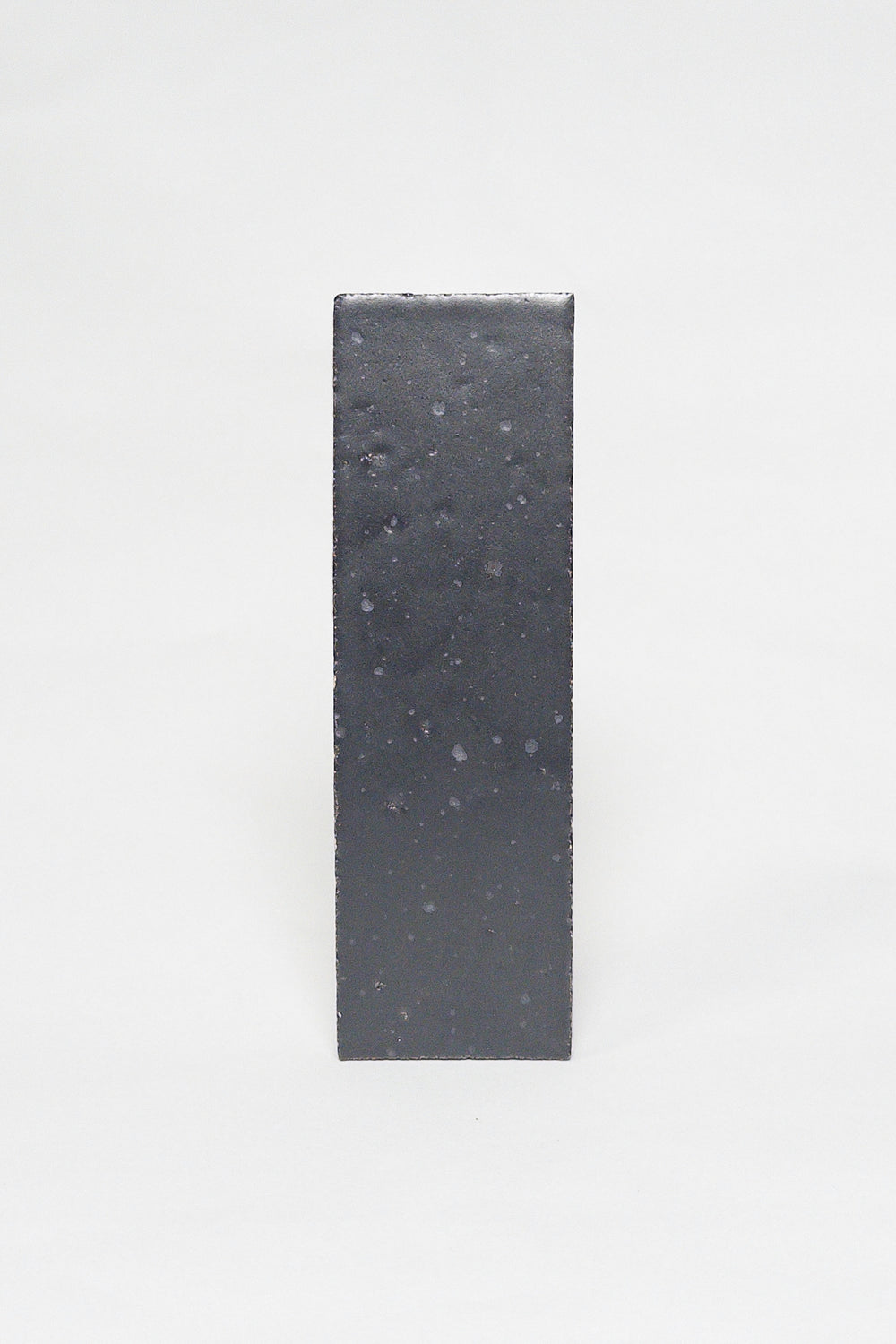Artisan Cast Iron charcoal thin brick tile with a matte glaze and subtly textured surface