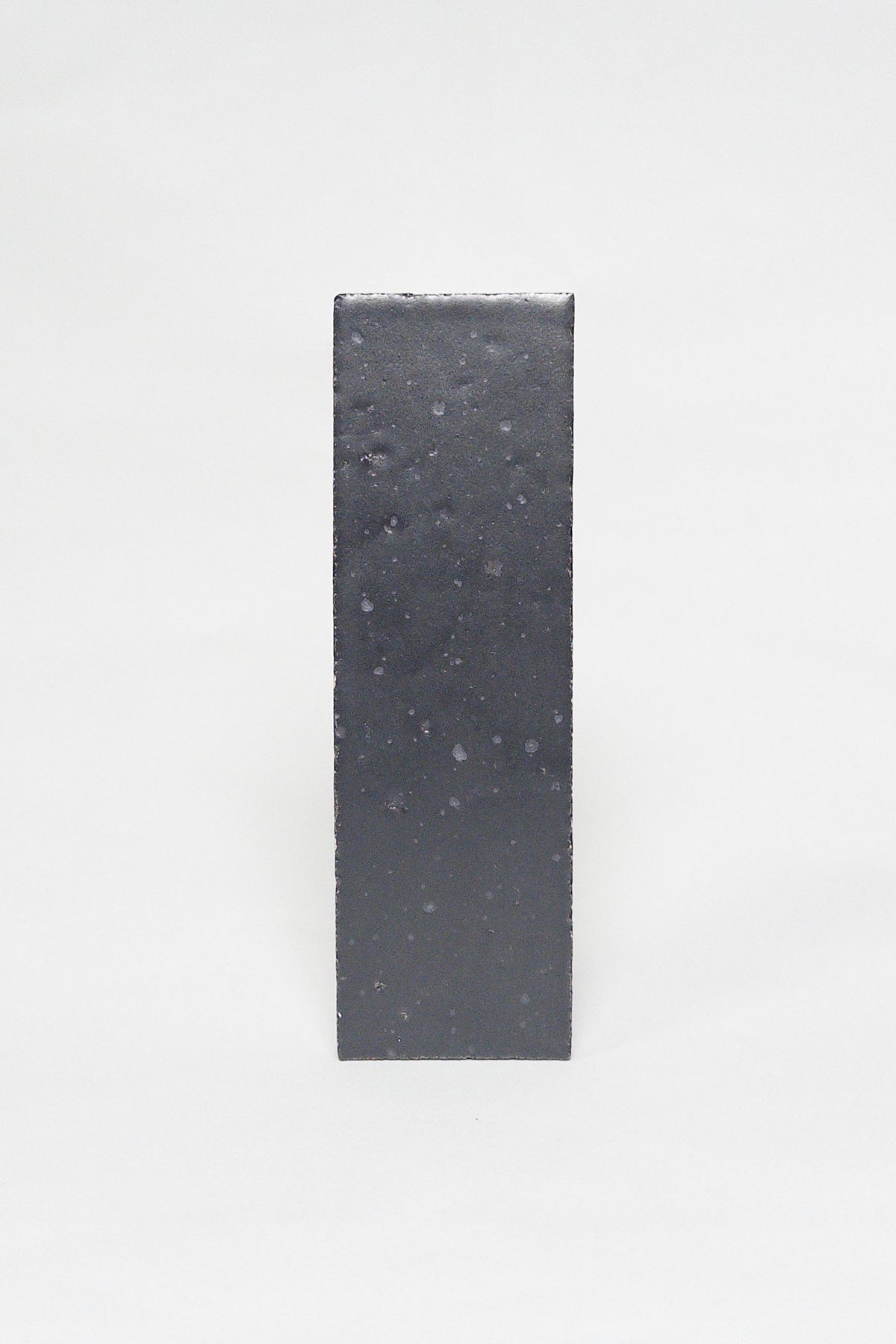 Artisan Cast Iron charcoal thin brick tile with a matte glaze and subtly textured surface