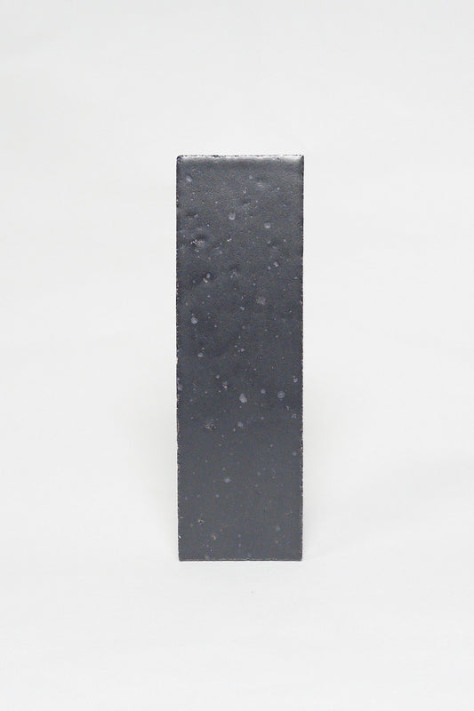 Artisan Cast Iron charcoal thin brick tile with a matte glaze and subtly textured surface