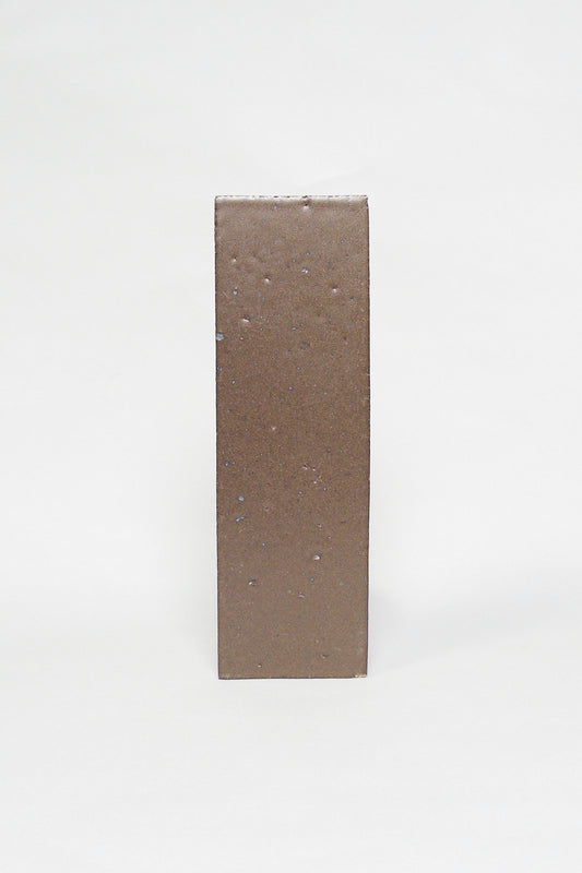 Artisan Chateau Brown warm brown thin brick tile with a matte glaze and subtle texture