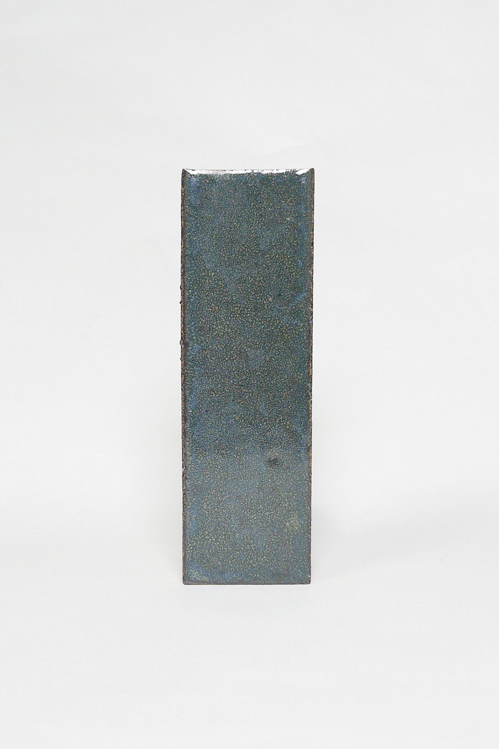 Artisan Deep Sea dark blue green thin brick tile with a glossy glaze and smoky undertones