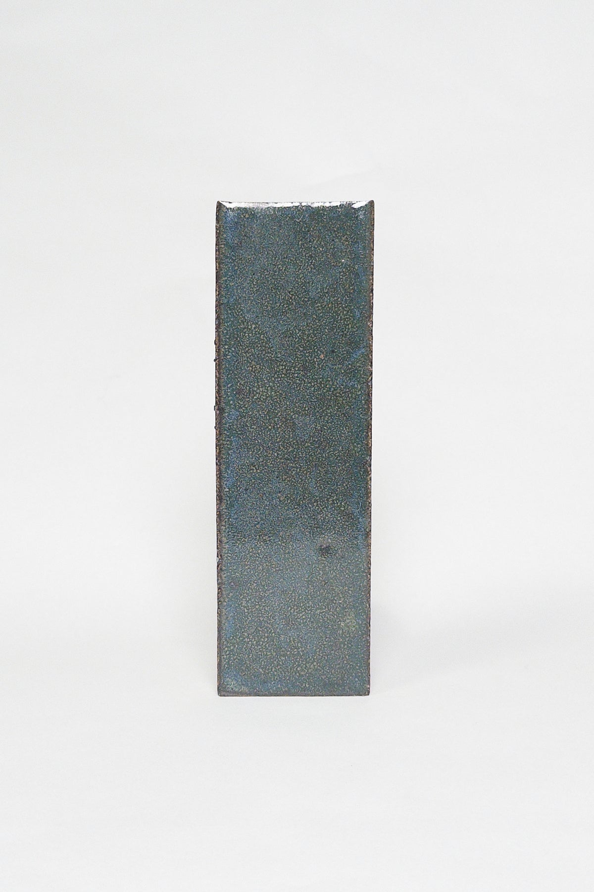 Artisan Deep Sea dark blue green thin brick tile with a glossy glaze and smoky undertones