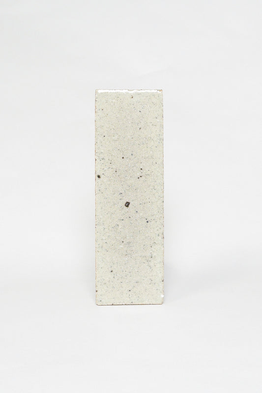 Artisan Dovetail light greige thin brick tile with a matte surface and darker speckles