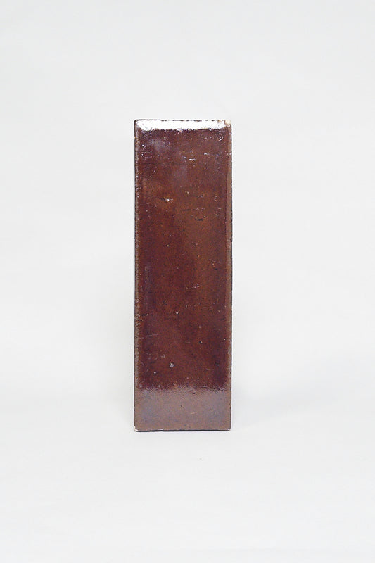 Artisan Java reddish brown thin brick tile with a glossy glaze and rich tonal variation