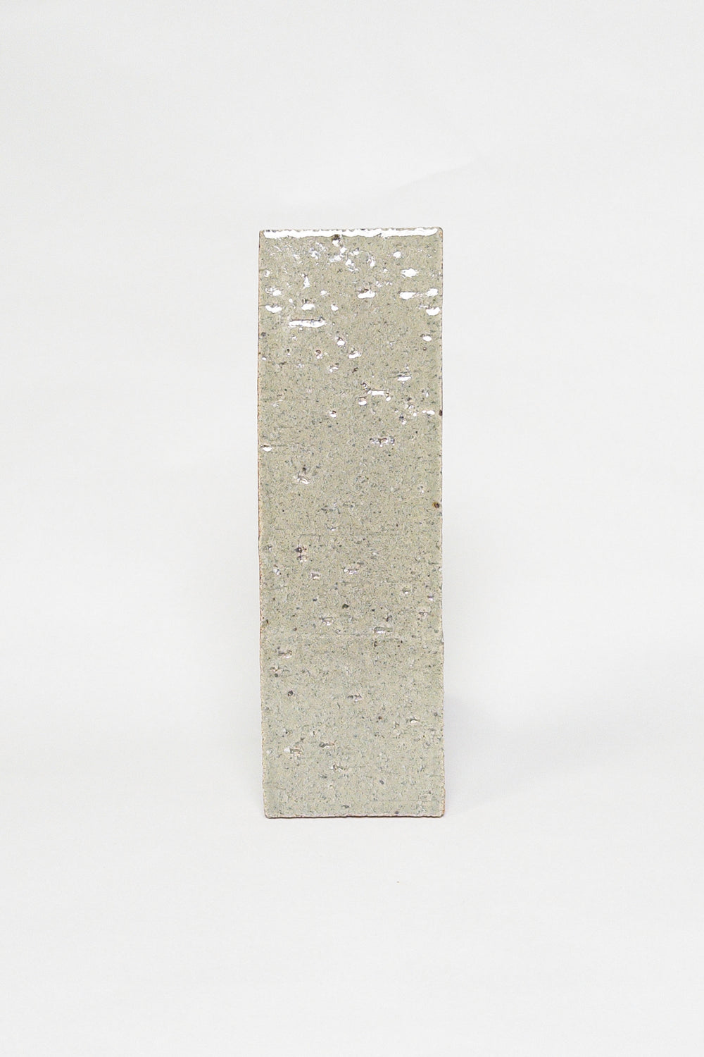 Artisan Khaki muted green grey thin brick tile with a glossy glaze and textured surface
