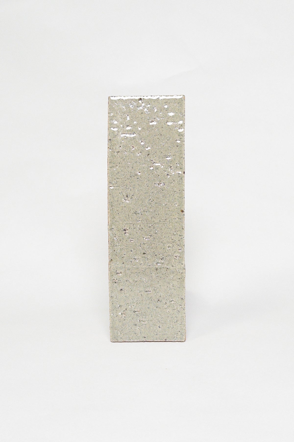 Artisan Khaki muted green grey thin brick tile with a glossy glaze and textured surface
