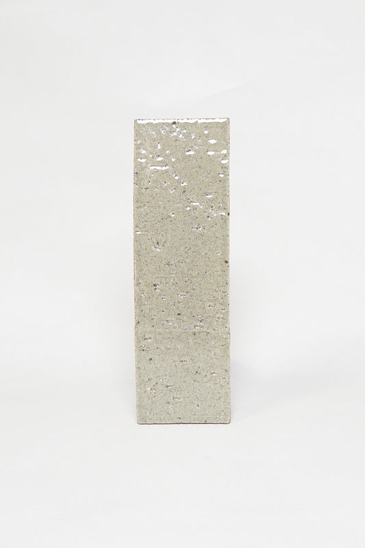 Artisan Khaki muted green grey thin brick tile with a glossy glaze and textured surface