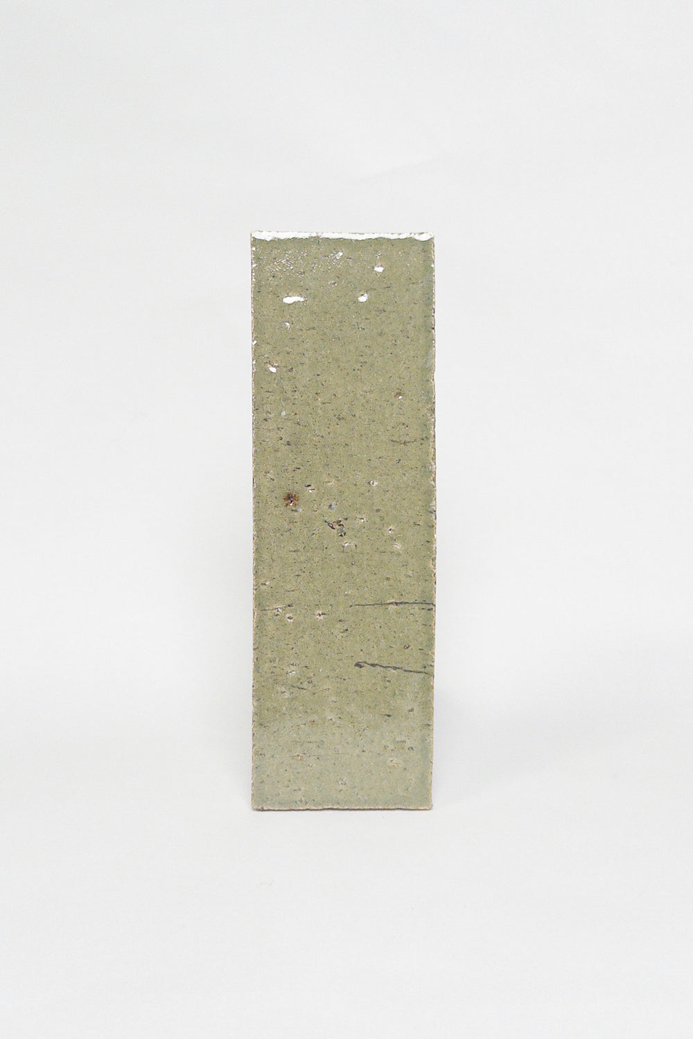 Artisan Moss green thin brick tile with a glossy glaze and earthy olive undertones