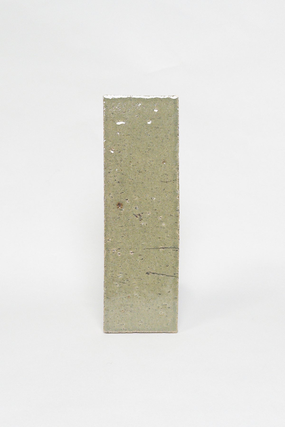 Artisan Moss green thin brick tile with a glossy glaze and earthy olive undertones