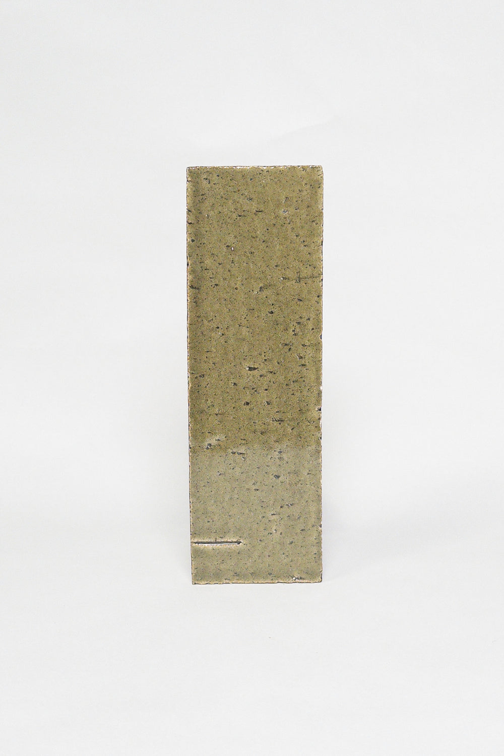 Artisan Olive Grove olive green thin brick tile with a glossy glaze and speckled texture