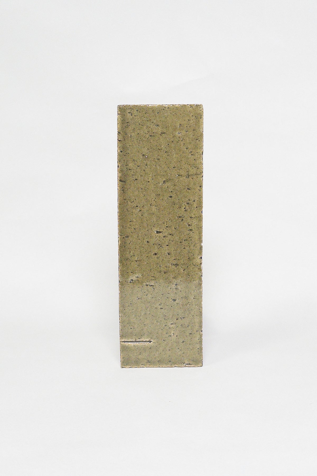 Artisan Olive Grove olive green thin brick tile with a glossy glaze and speckled texture