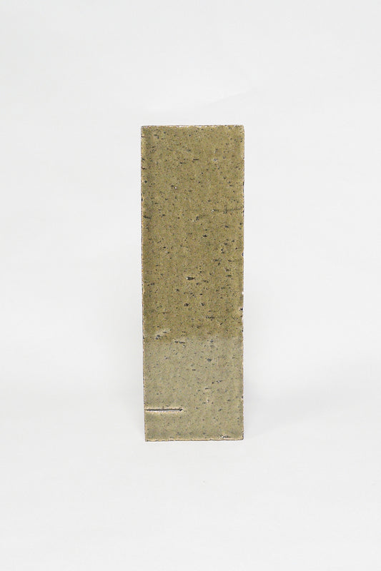 Artisan Olive Grove olive green thin brick tile with a glossy glaze and speckled texture
