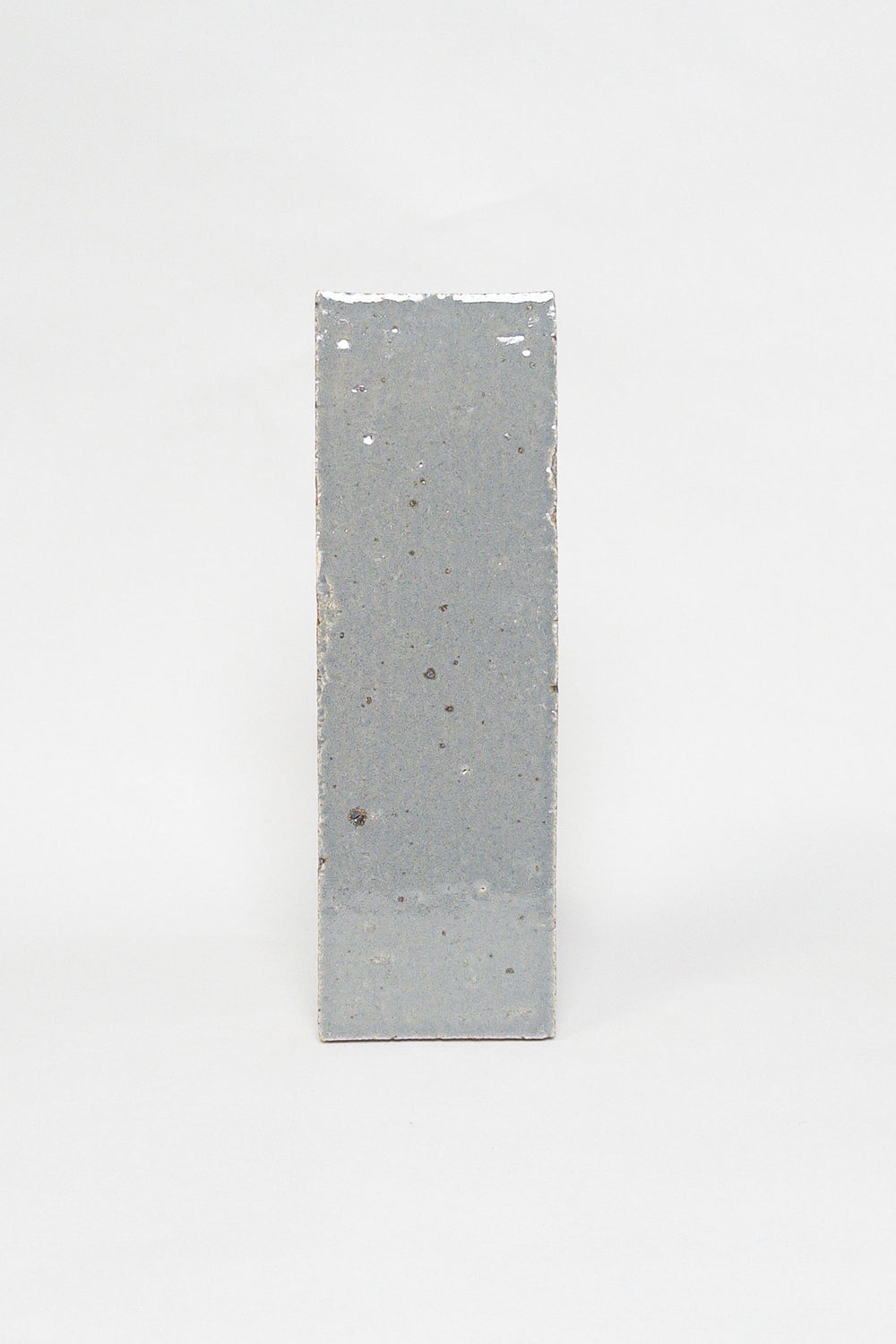 Artisan Smoke grey thin brick tile with a glossy glaze and softly varied surface