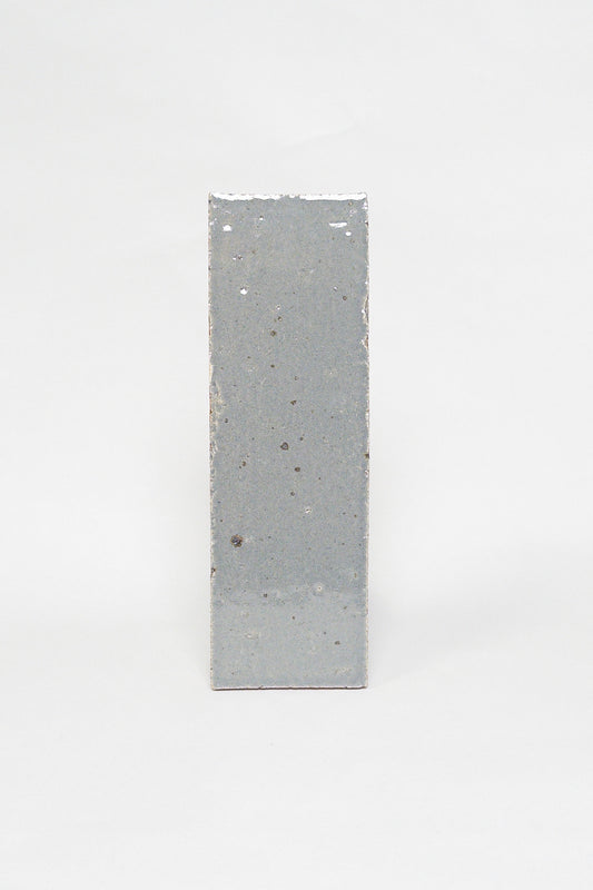 Artisan Smoke grey thin brick tile with a glossy glaze and softly varied surface