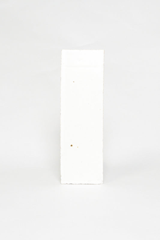 Artisan Snowfall white thin brick tile with a matte glaze and subtle surface texture