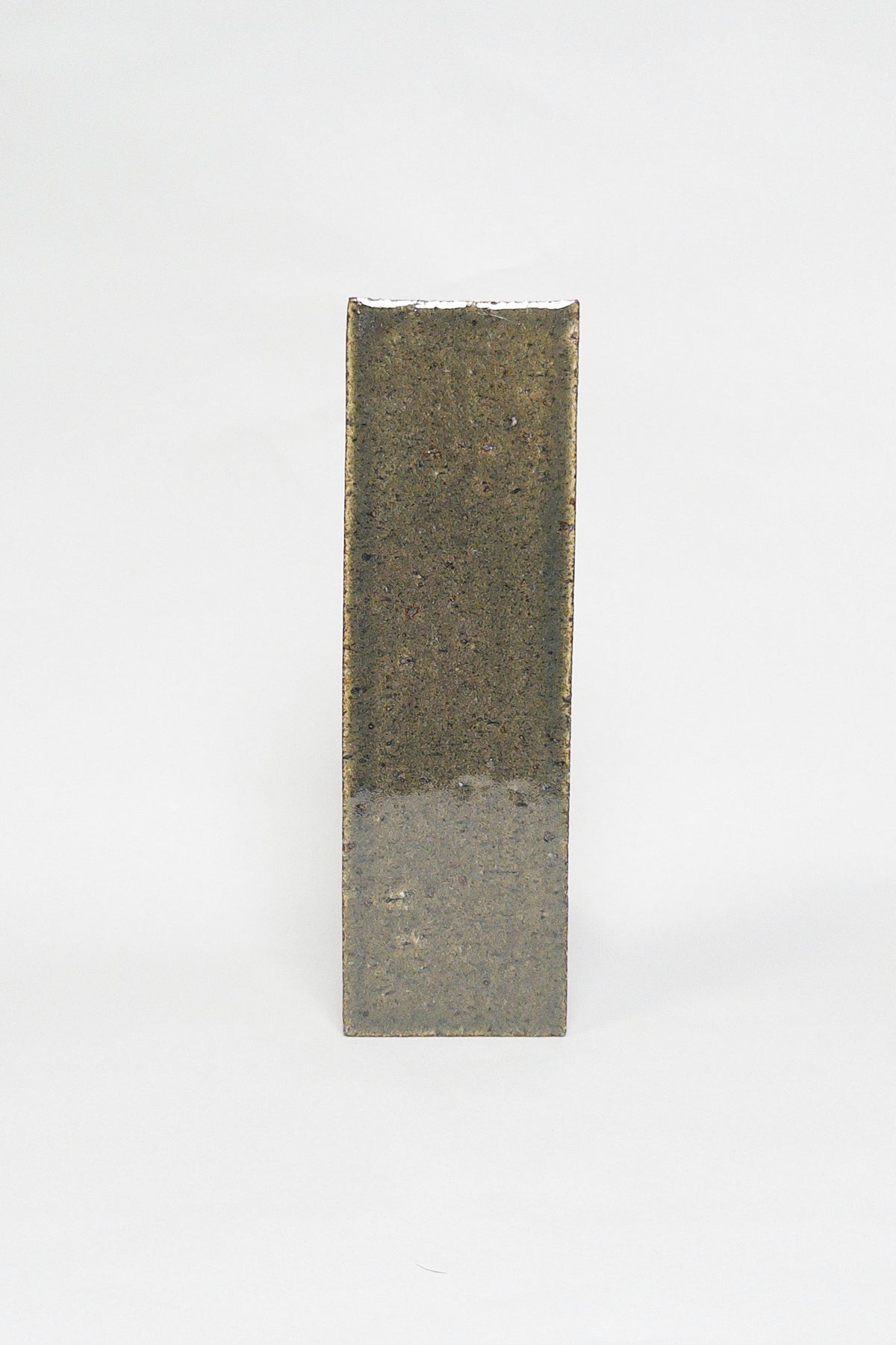 Artisan Topiary Green dark earthy green thin brick tile with a glossy glaze