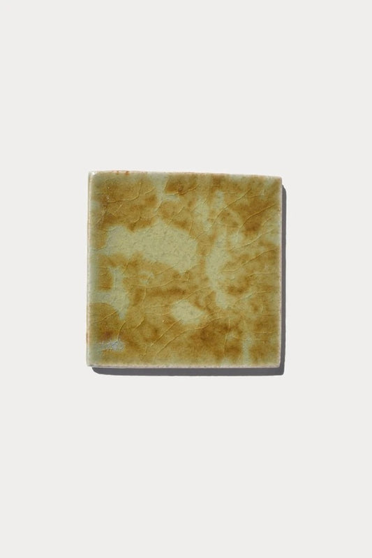 Ember OLIVE Piedras 7 tile sample on off-white background