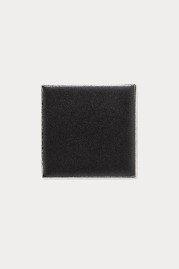 Summit BADLANDS Charcoal Matte tile sample on off-white background